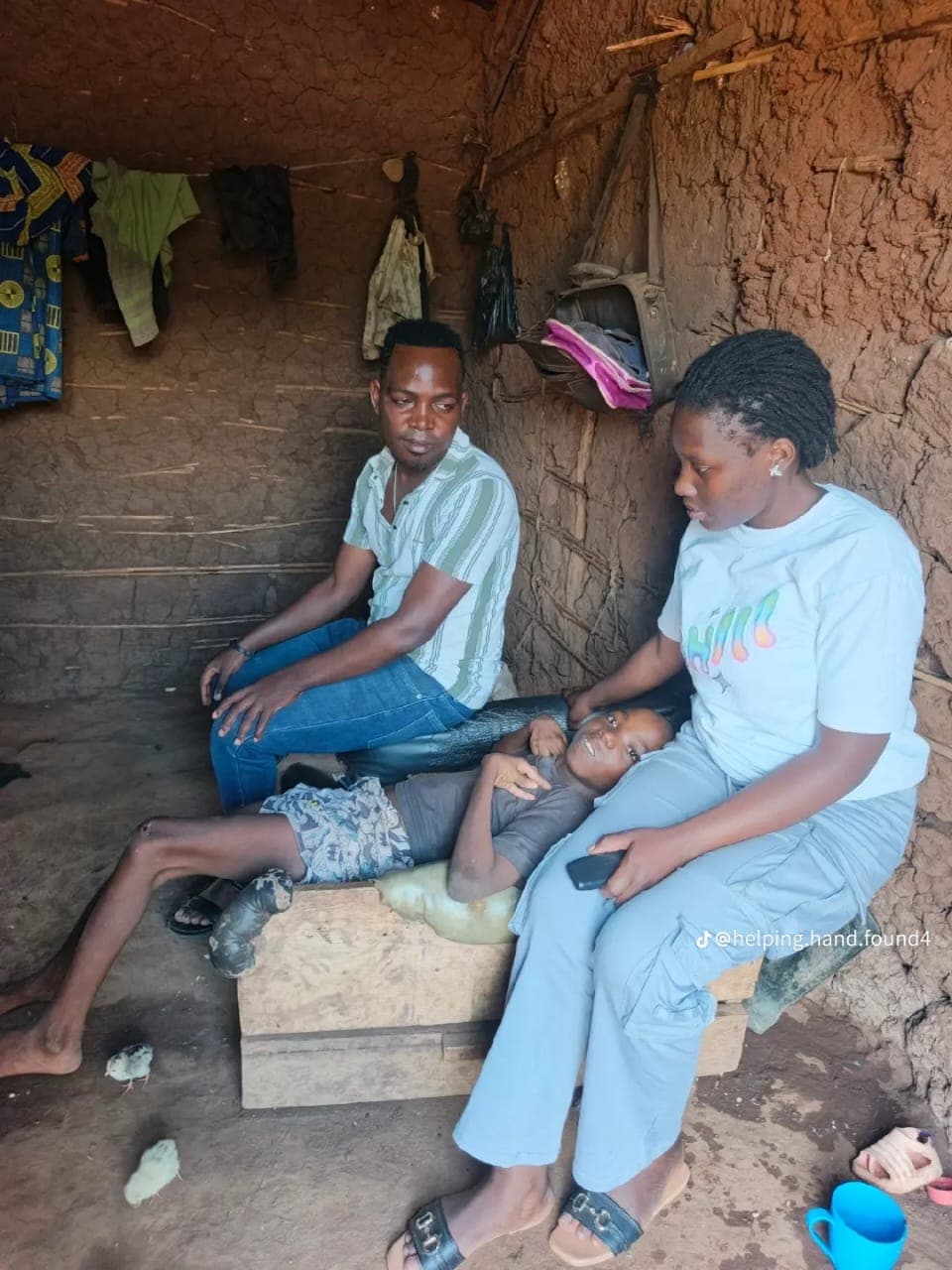 Team members visiting a child and family at home in Uganda